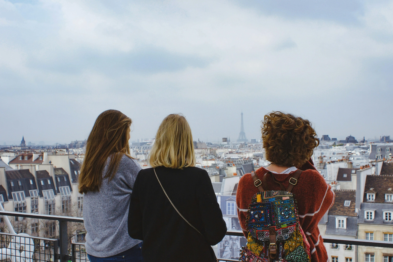 Photo of group of students looking out across Paris, France. MFL School Trips
